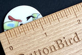 Running Low, Vespa Scooter Button - Porcelain 1- 1/8" diameter