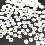 116-120 Buttons: White River Shell Size Mix: 4-Hole.  3/8", 9/16", 5/8", 13/16".   # LP-111