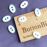 Re-Stocked White Oval Shell 2-Hole Tiny 1/2" Button.  Pack of TEN Buttons #LP-01