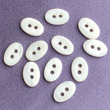 Re-Stocked White Oval Shell 2-Hole Tiny 1/2" Button.  Pack of TEN Buttons #LP-01